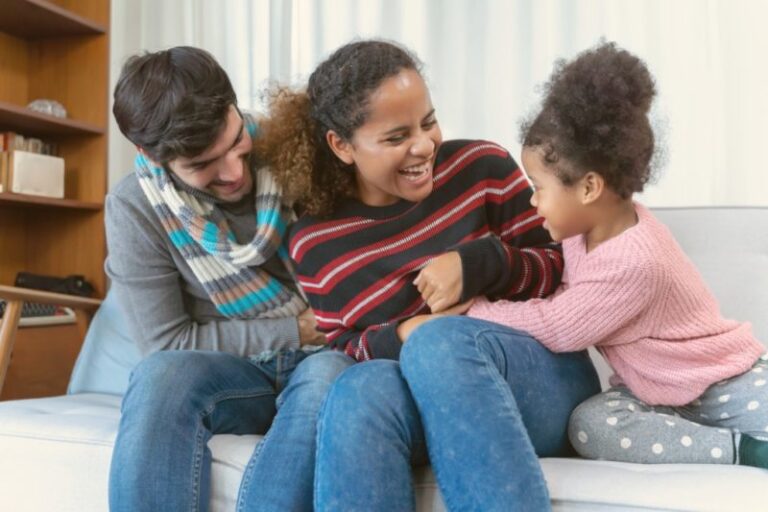 happy family tickling each other