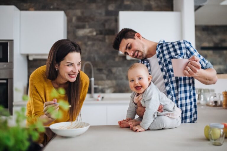 Happy Family Standing in Kitchen