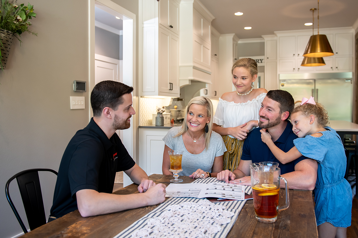 Trane rep speaking to family